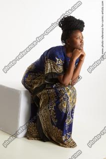 Dina Moses African Woman Sitting Pose